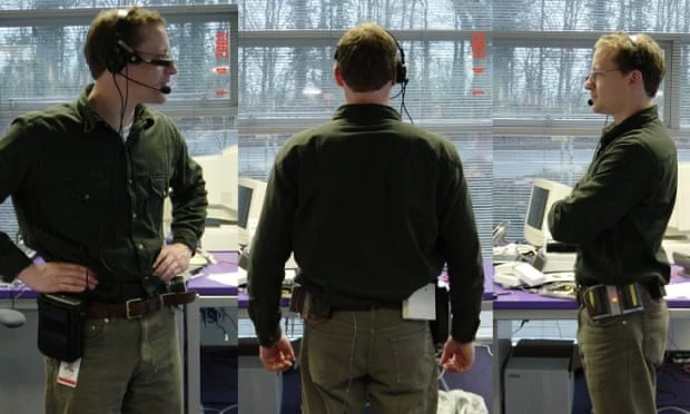 Three views of a man wearing the Dyson Halo headset and belt-mounted electronics